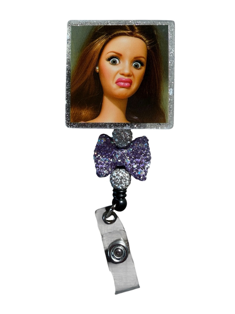Sparkling Purple Bow Badge Reel with Doll-Face Accent